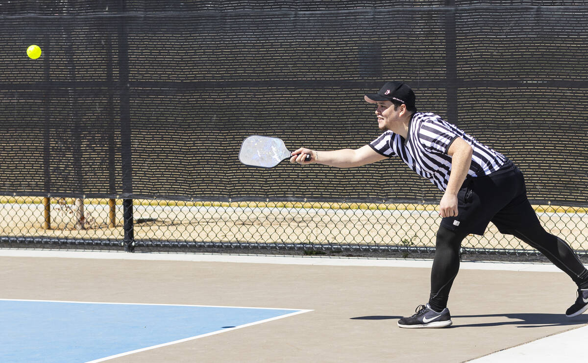 Caleb Ritua, of Las Vegas, plays pickleball at the Sunset Park pickleball complex on Tuesday, A ...