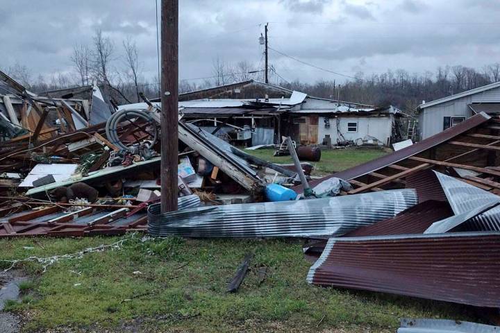 Debris covers the ground as homes are damaged after severe weather in Glen Allen, Mo., on Wedne ...