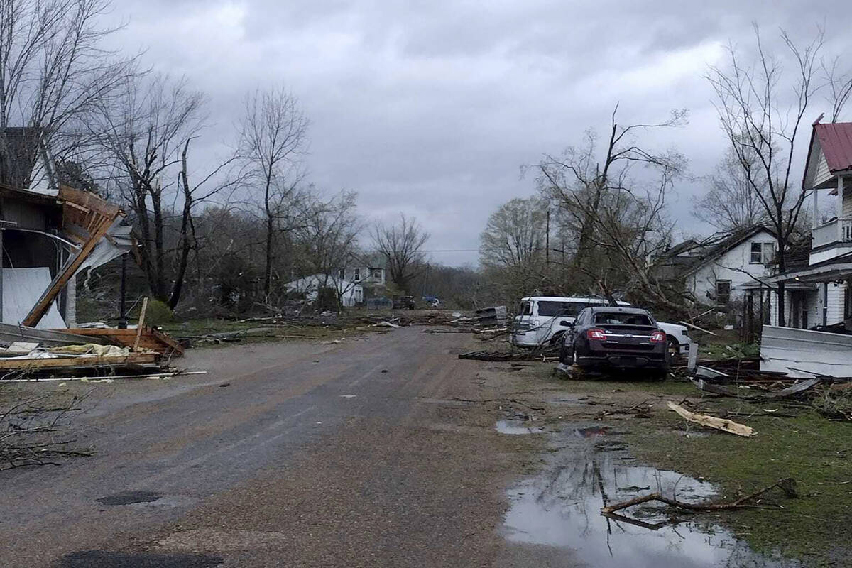 Debris covers the ground as homes are damaged after severe weather in Glen Allen, Mo., on Wedne ...