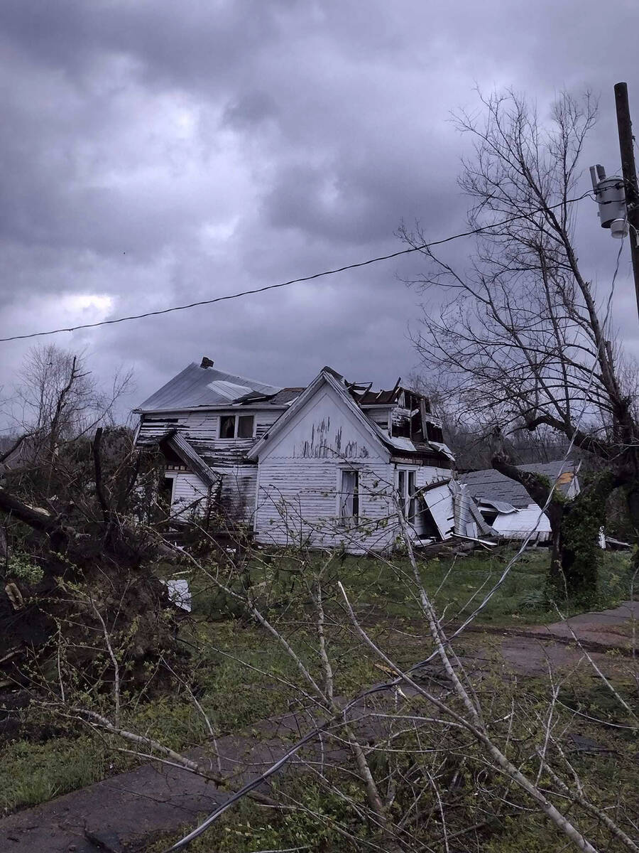 Debris covers the ground as homes are damaged after severe weather in Glen Allen, Mo., on Wedne ...