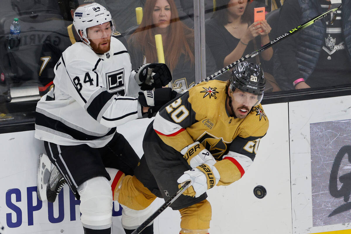 Golden Knights center Chandler Stephenson (20) and Los Angeles Kings defenseman Vladislav Gavri ...