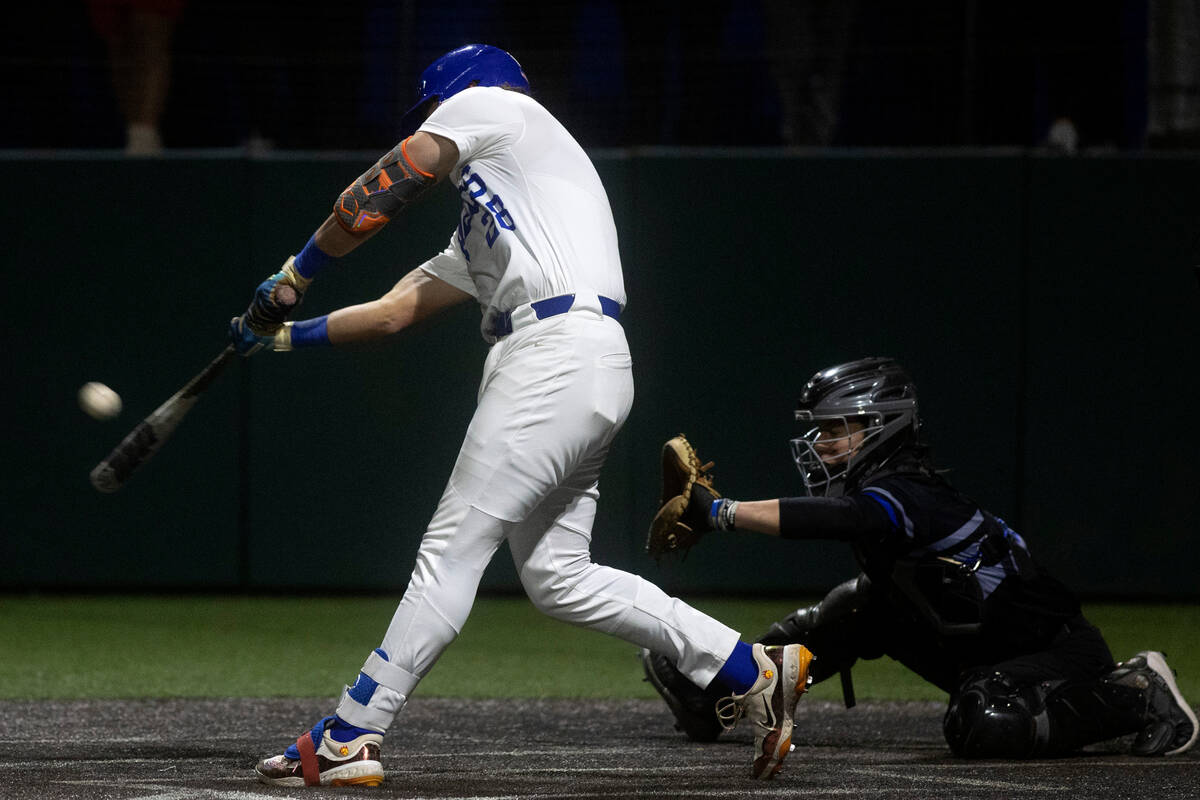 Bishop Gorman first baseman Easton Shelton hits the game-winning home run during a high school ...