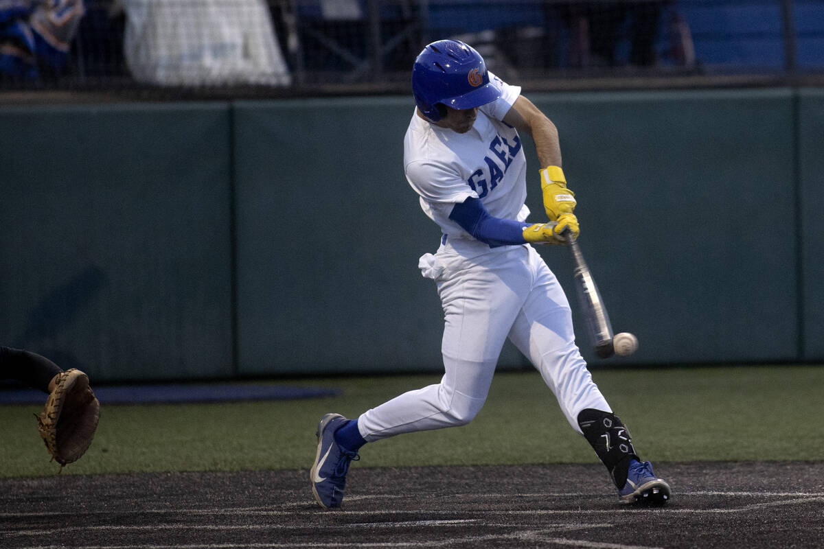 Bishop Gorman second baseman Maddox Riske bats against Basic during a high school baseball cham ...