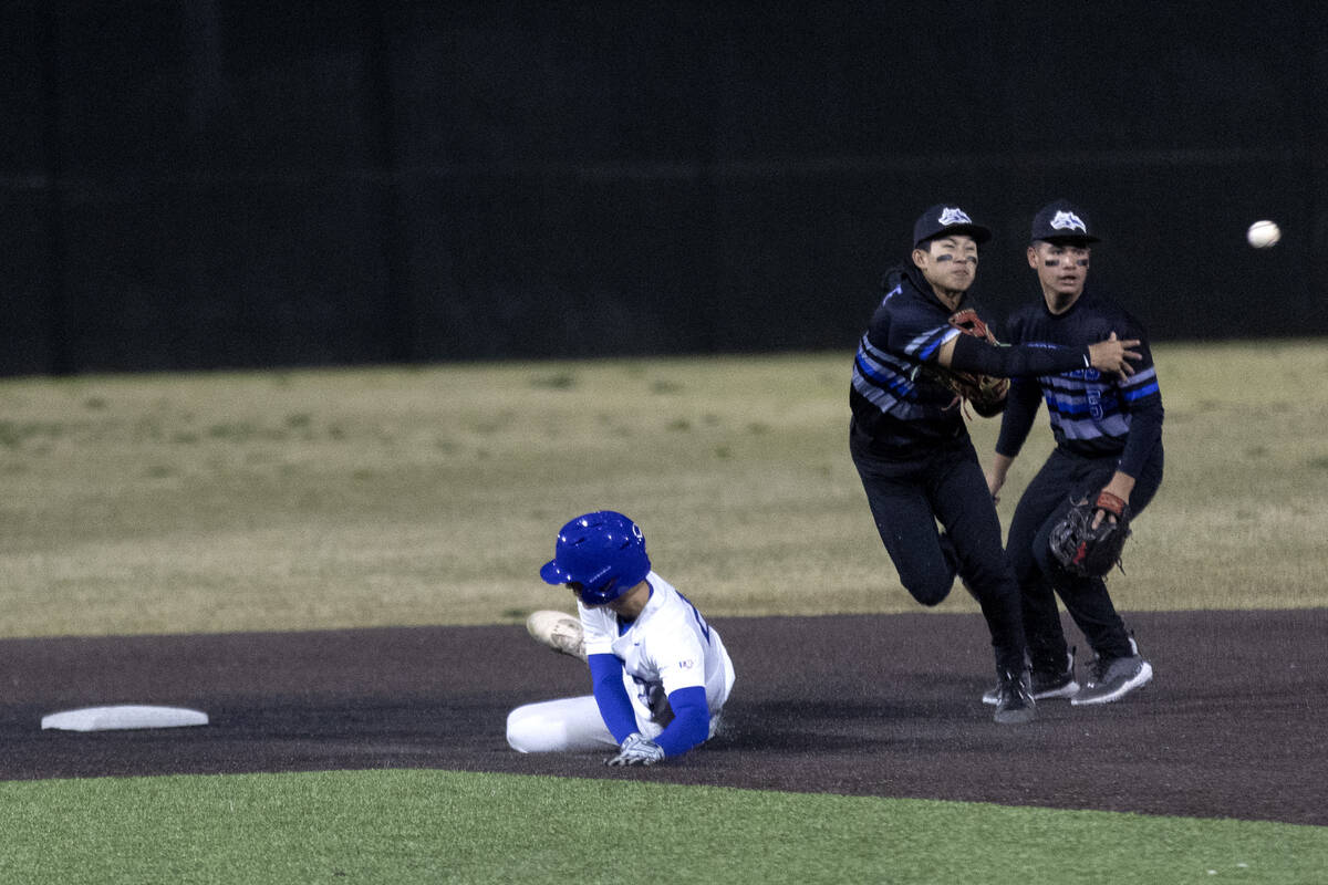 Basic shortstop Ty Southisene throws to first base after making an out at second while Bishop G ...