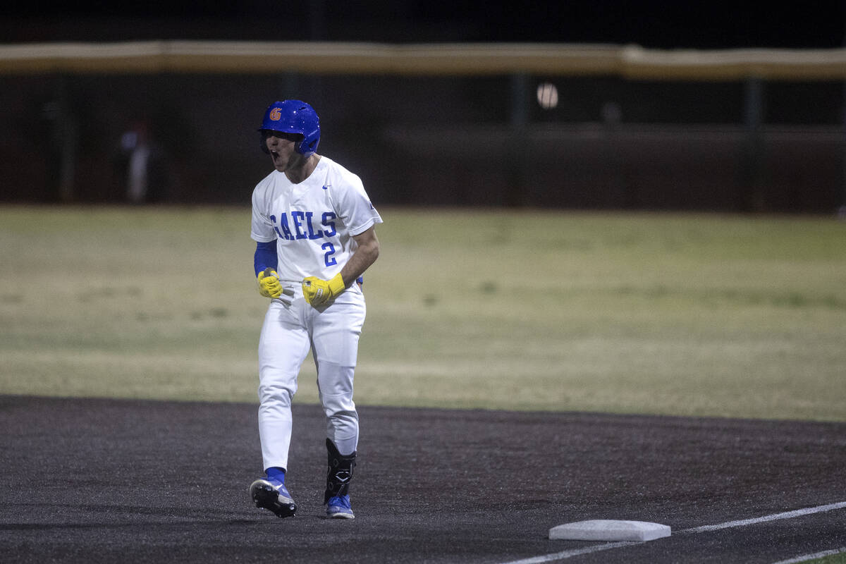 Bishop Gorman’s Maddox Riske celebrates after getting a base hit during a high school ba ...