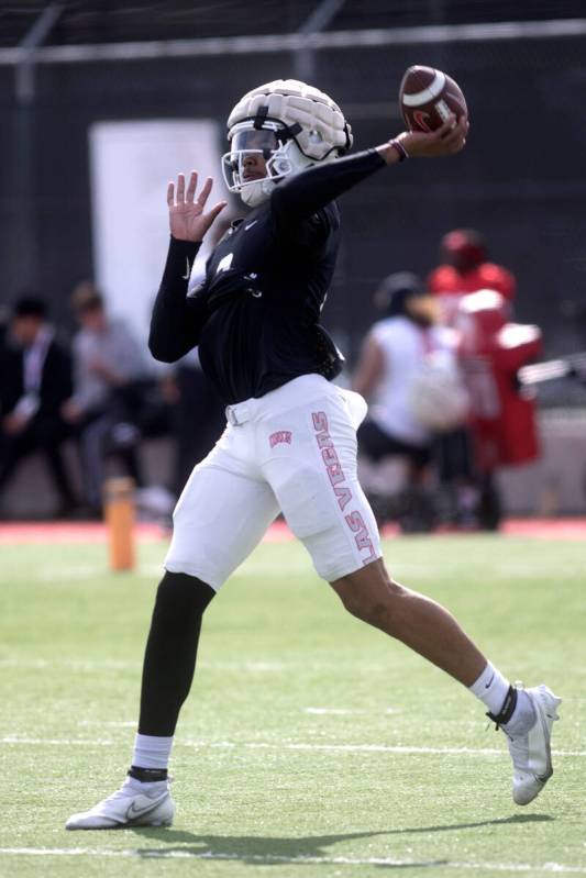 Quarterback Doug Brumfield throws during UNLV football practice at Fertitta Football Complex on ...