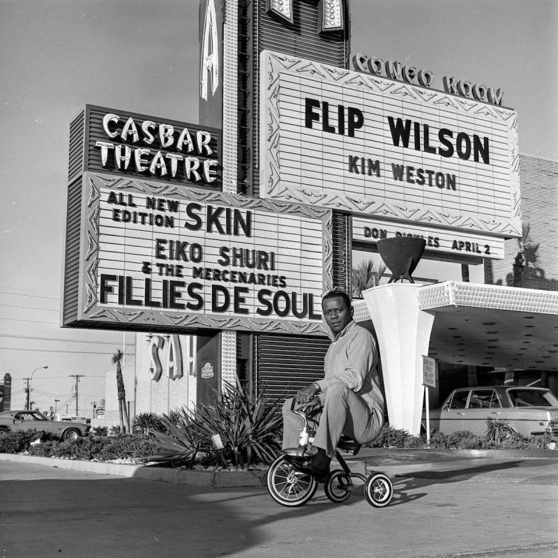 Flip Wilson rides a tricycle outside of the Sahara on March 18, 1970. (Las Vegas News Bureau)