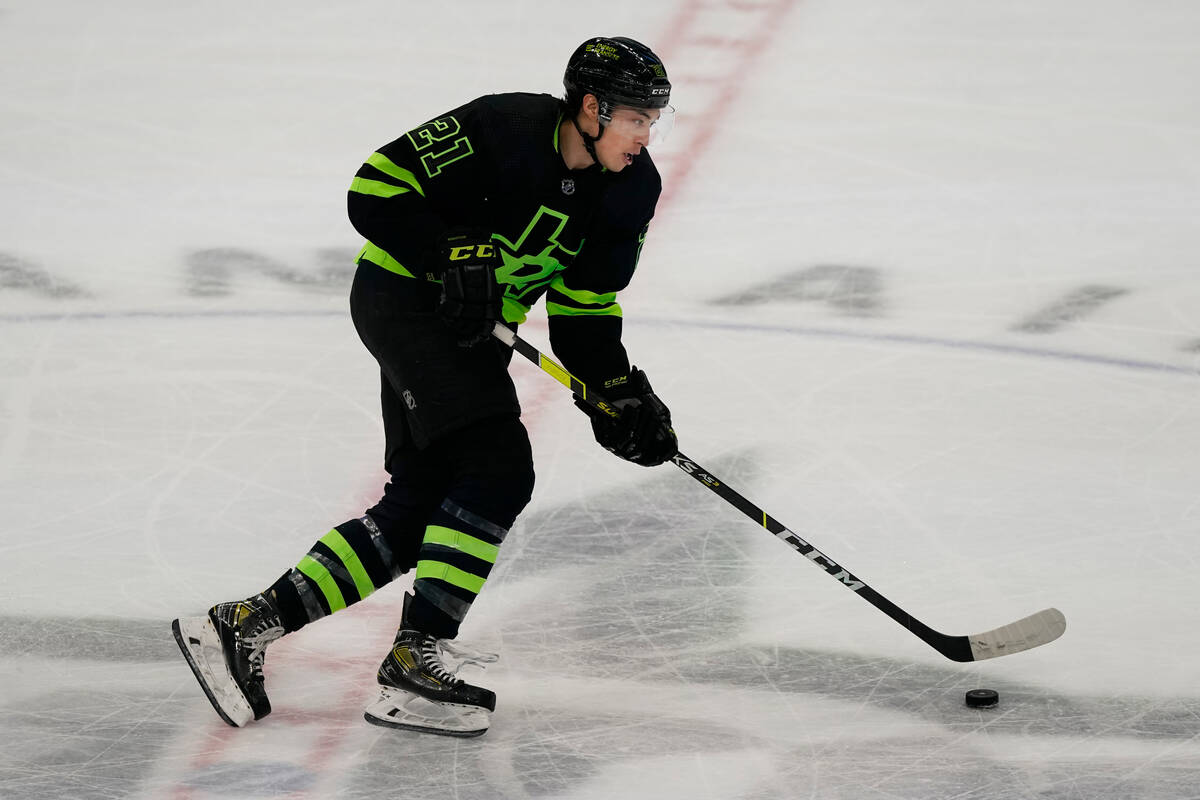 Dallas Stars left wing Jason Robertson (21) skates with the puck during the second period of an ...