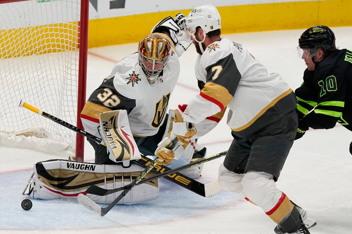 Vegas Golden Knights goaltender Jonathan Quick (32) and defenseman Alex Pietrangelo (7) defend ...