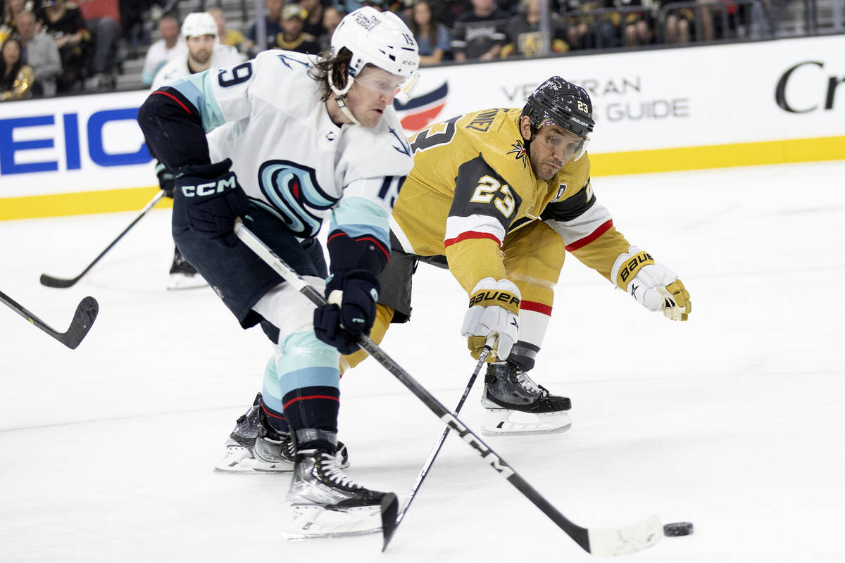 Golden Knights defenseman Alec Martinez (23) reaches to block against Seattle Kraken left wing ...