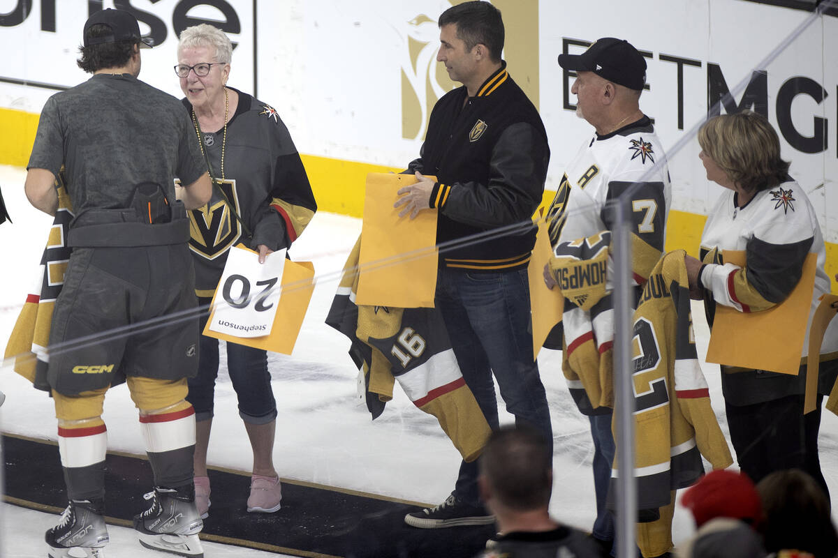 Golden Knights center Chandler Stephenson gives a fan a signed jersey on Fan Appreciation Knigh ...