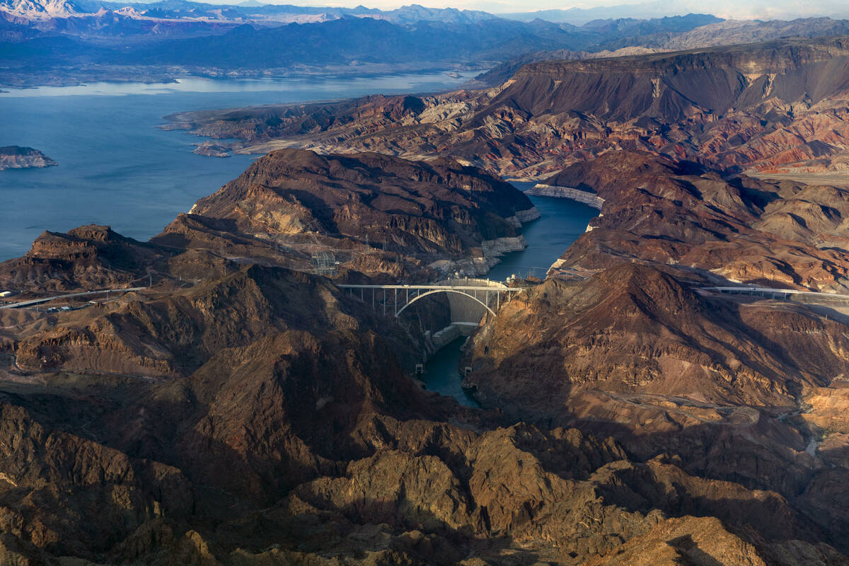 Hoover Dam with the lower Lake Mead shoreline, above, and Colorado River continuing below on Ma ...