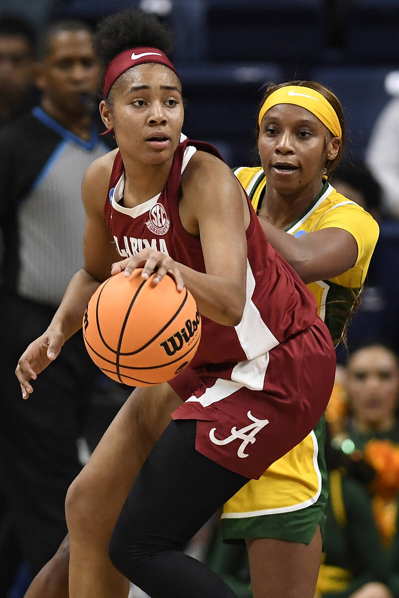 Alabama's Brittany Davis, front is guarded by Baylor's Ja'Mee Asberry in the first half of a fi ...