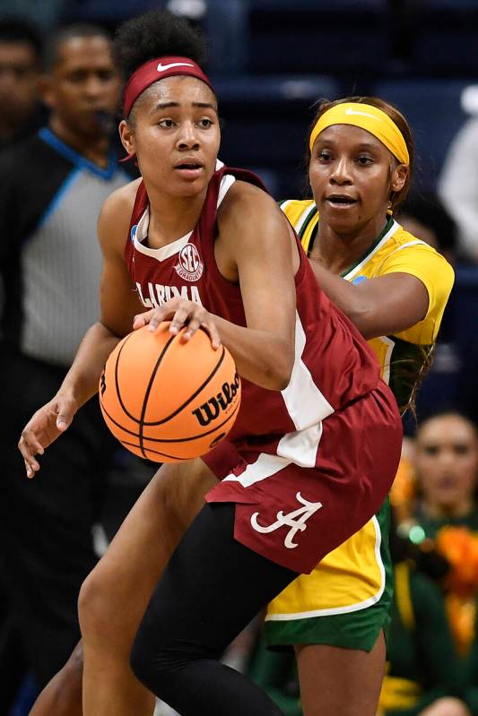 Alabama's Brittany Davis, front is guarded by Baylor's Ja'Mee Asberry in the first half of a fi ...