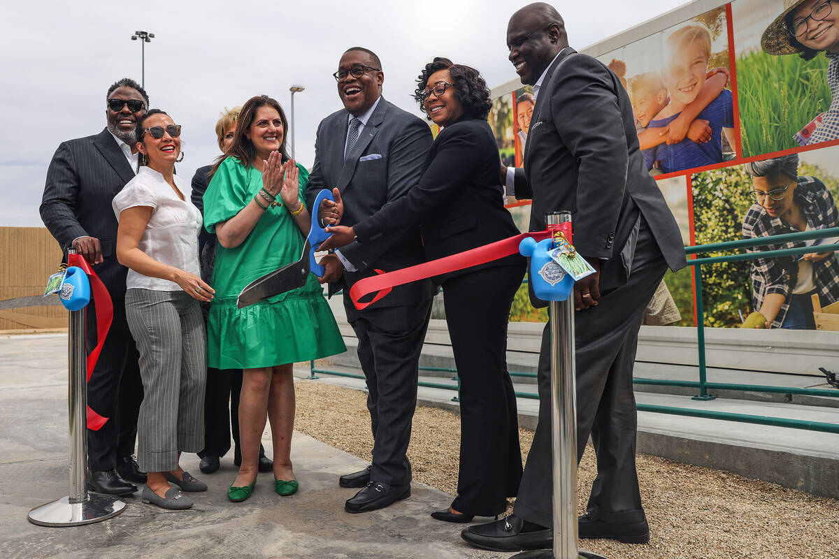 Las Vegas City Councilman Cedric Crear cuts the ribbon for the opening of two urban farm contai ...