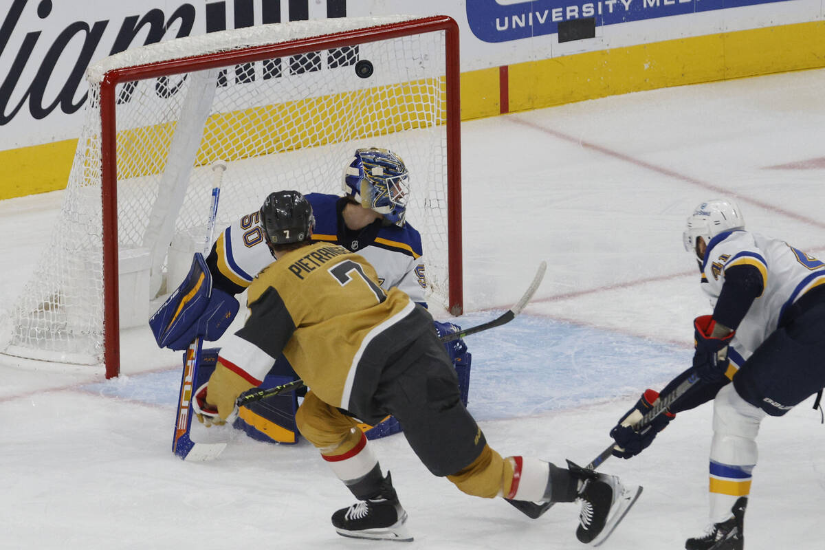 Golden Knights defenseman Alex Pietrangelo (7) scores against St. Louis Blues goaltender Jordan ...