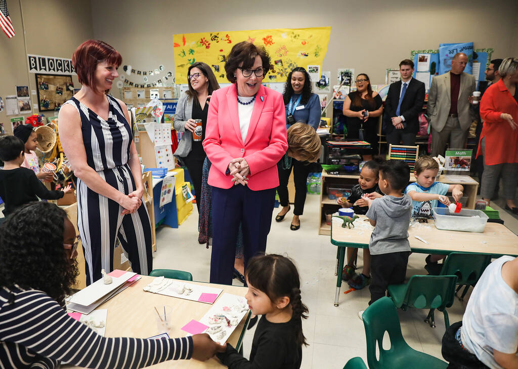 Brianna Barber, executive director, left, leads Sen. Jackie Rosen, D-Nev., right, on a tour of ...