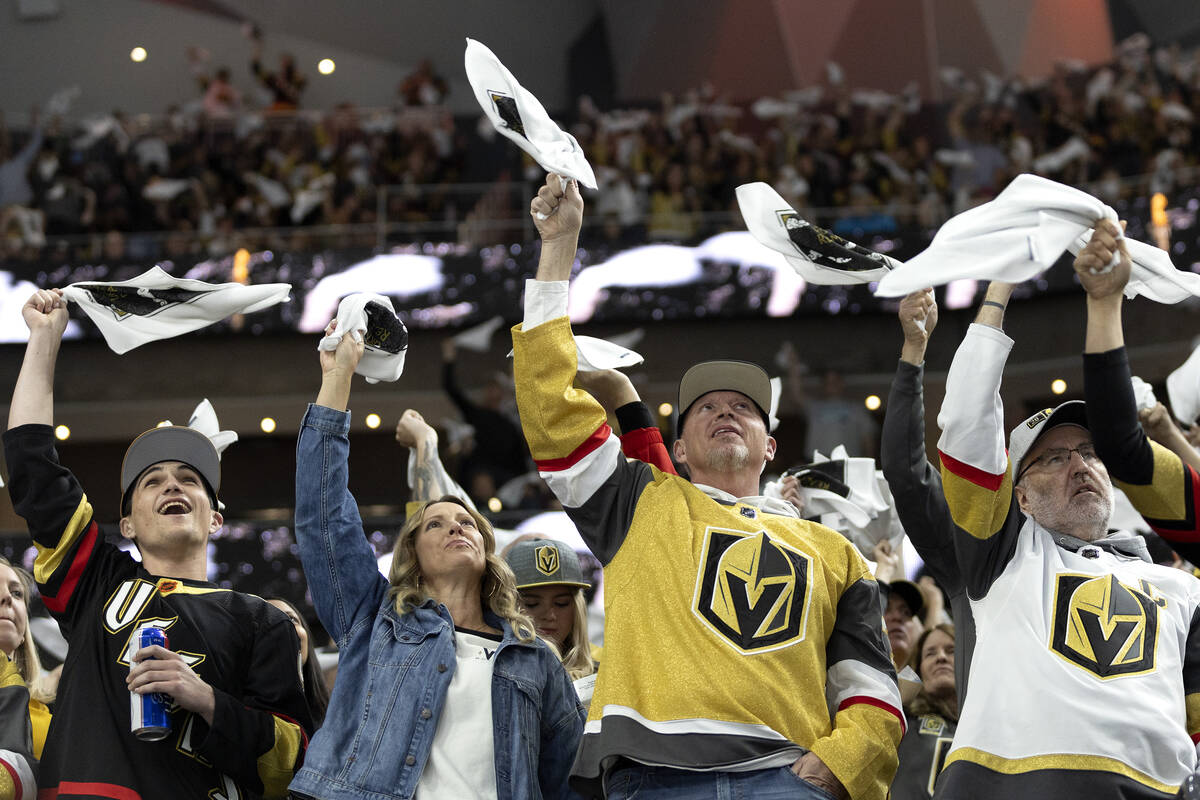 Golden Knights fans wave their towels during the first period in Game 1 of an NHL hockey Stanle ...