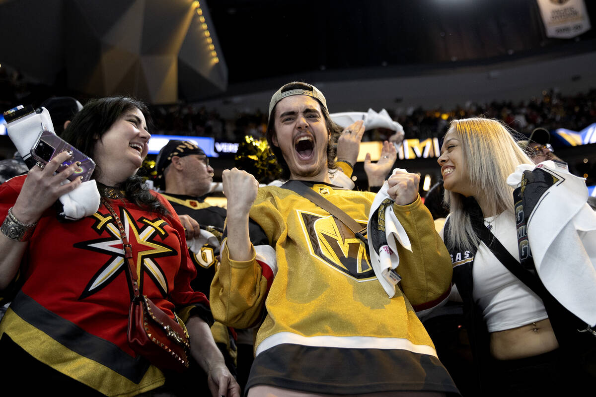 Kathy Banton, left, Robert Kongelbak-Leask and Sandra Cardenas celebrate after the Golden Knigh ...