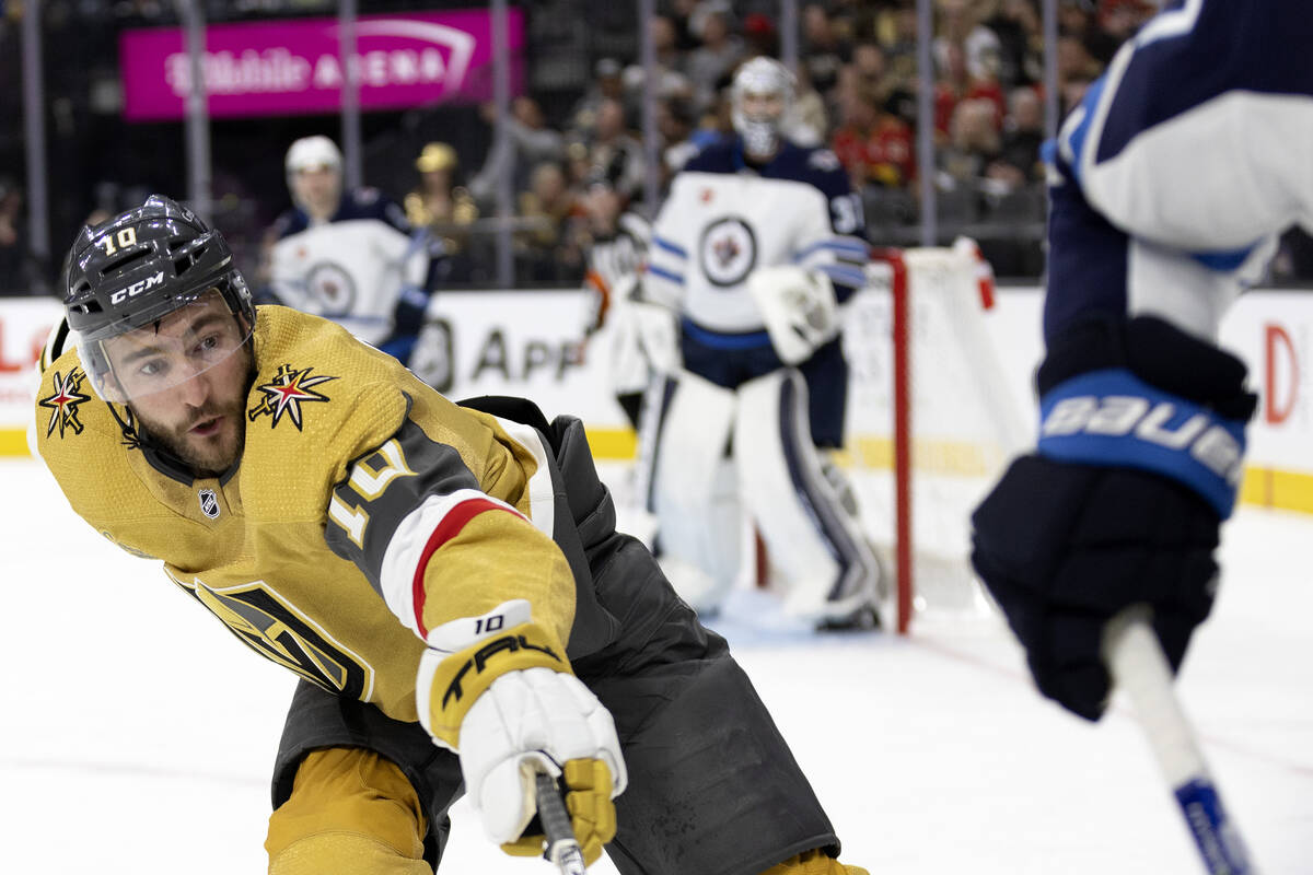 Golden Knights center Nicolas Roy (10) reaches for the puck during the third period in Game 1 o ...