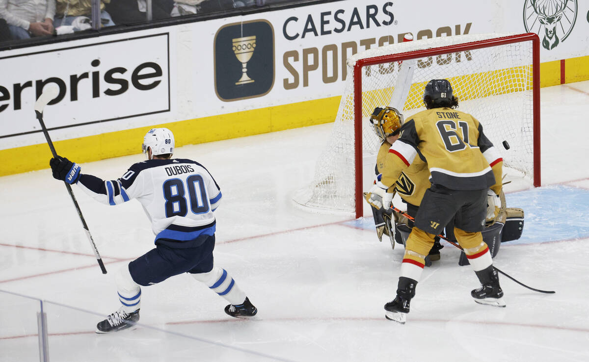 Winnipeg Jets left wing Pierre-Luc Dubois (80) scores a goal against Golden Knights goaltender ...