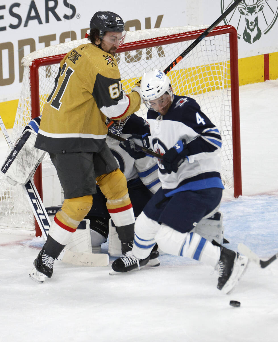 Golden Knights right wing Mark Stone (61) keeps an eye on a puck during the third period of Gam ...