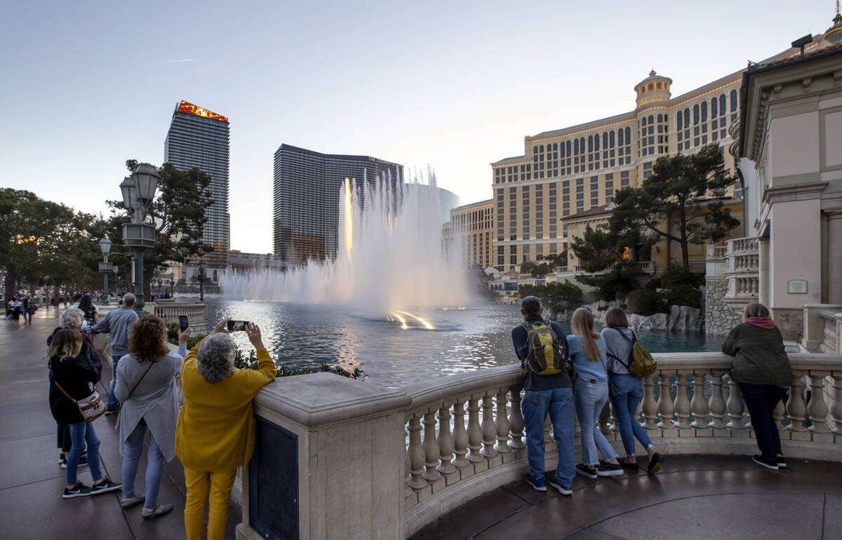 People watch the Bellagio Fountains in January 2022 in Las Vegas. (L.E. Baskow/Las Vegas Review ...