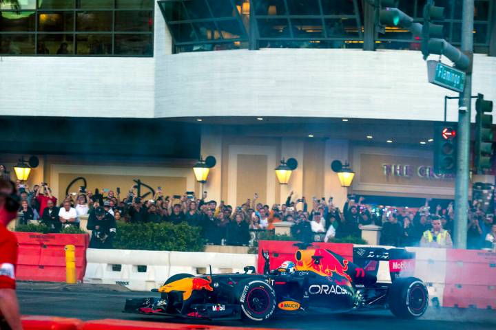 Racer Sergio Pérez turns doughnuts across from the Cromwell while waving to fans racing down t ...