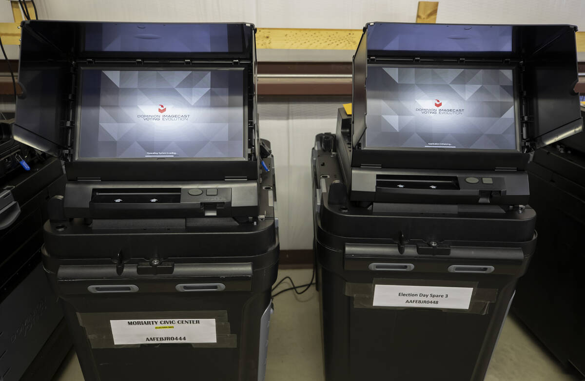 FILE - Dominion Voting ballot-counting machines are shown at a Torrance County warehouse during ...