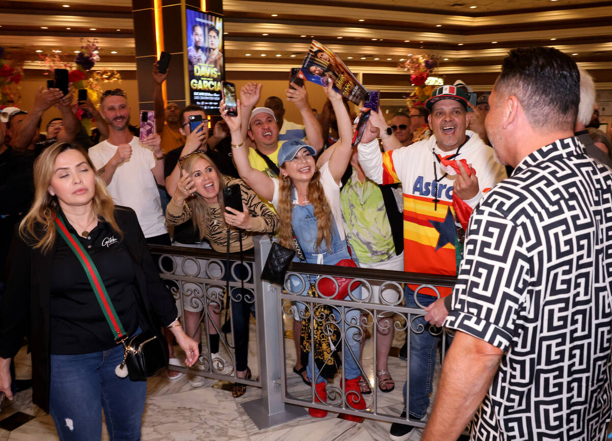 Fans cheer for boxing promoter and former champion Oscar De La Hoya during the Gervonta Davis-R ...