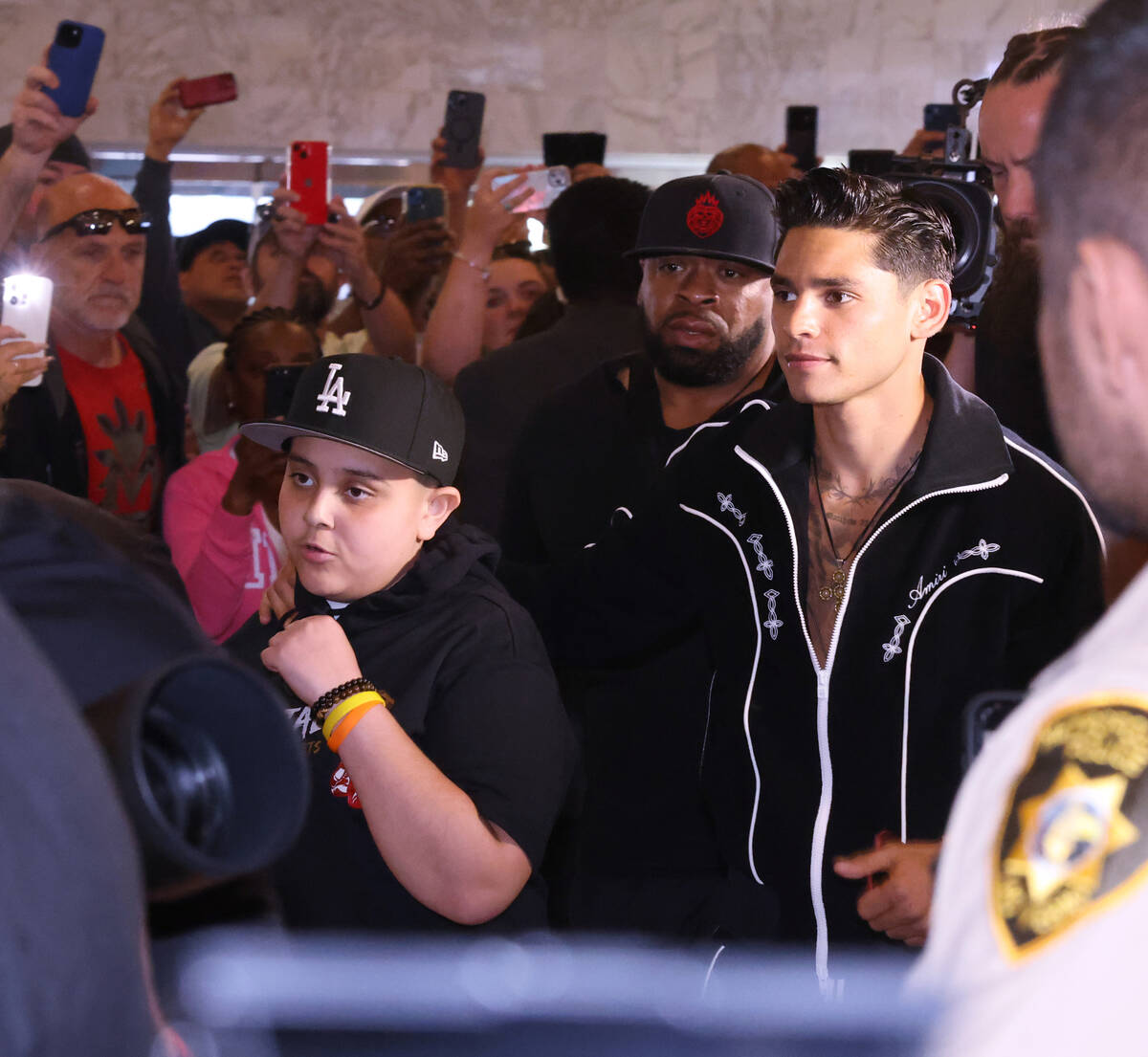 Fans cheer as Ryan Garcia makes his way to the stage during the grand arrivals event at MGM Gra ...