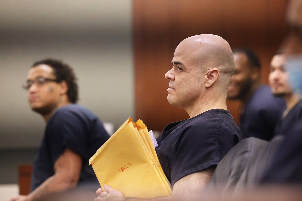 Former Clark County Public Administrator Robert Telles waits in court for a hearing at the Regi ...