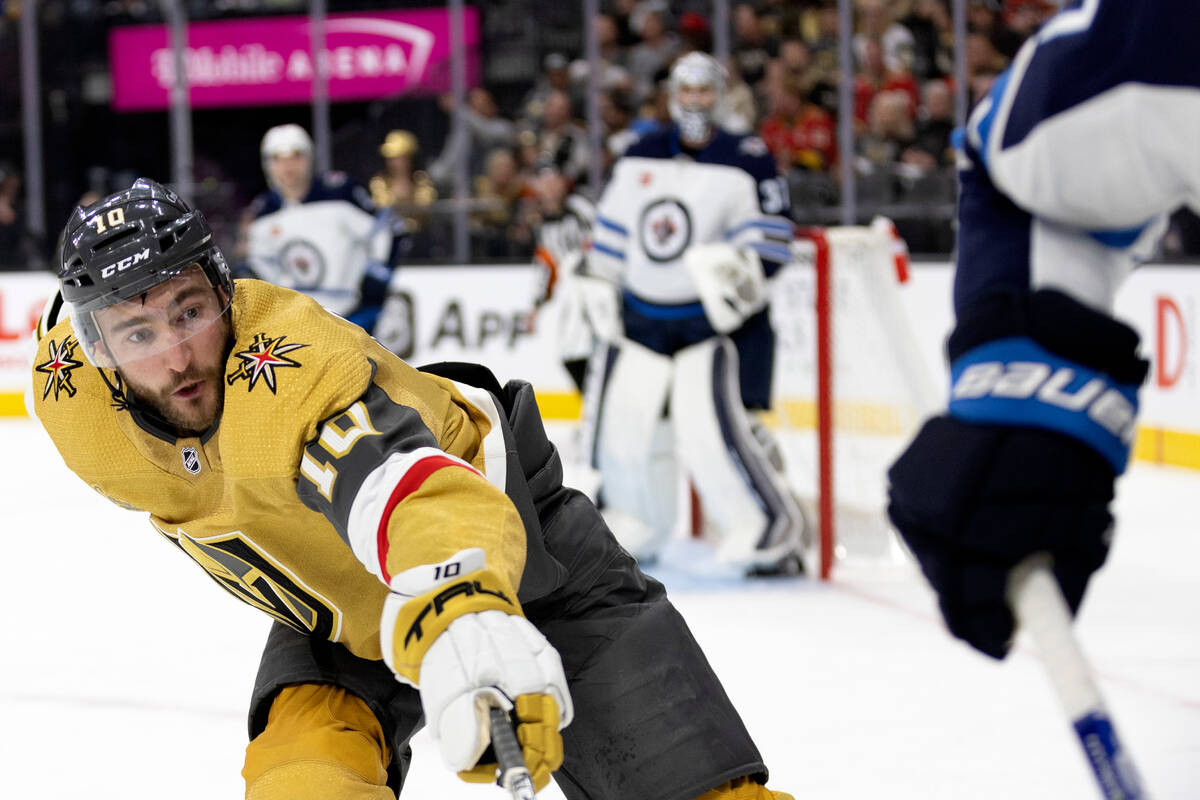 Golden Knights center Nicolas Roy (10) reaches for the puck during the third period in Game 1 o ...