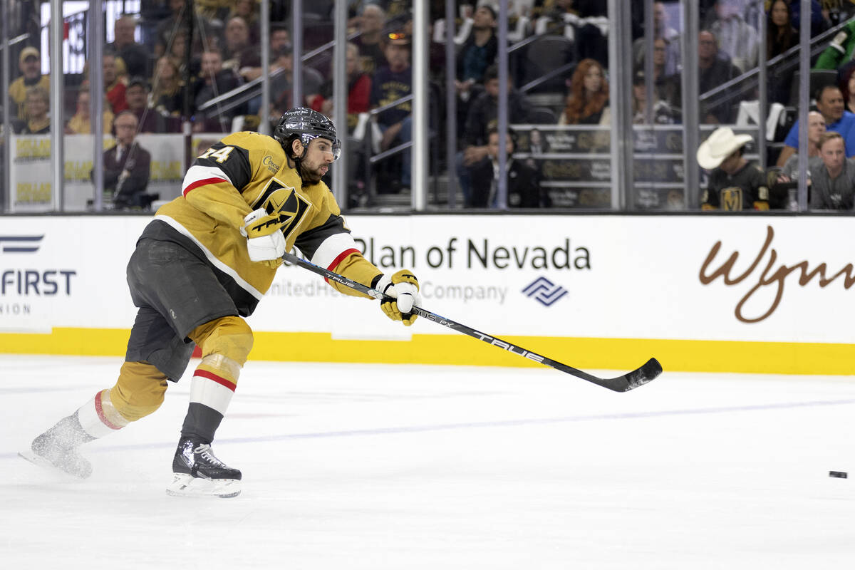 Golden Knights defenseman Nicolas Hague (14) shoots during the third period of Game 2 of an NHL ...