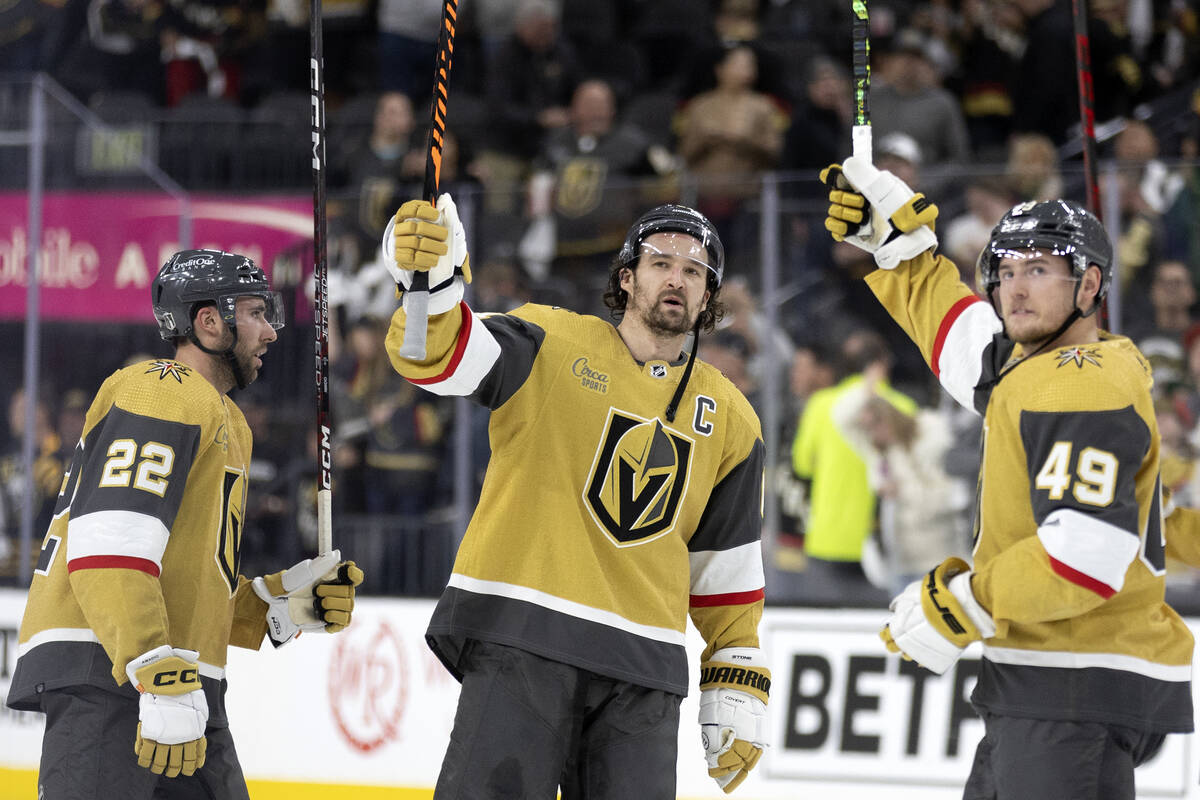 Golden Knights right wing Michael Amadio (22), right wing Mark Stone (61) and center Ivan Barba ...