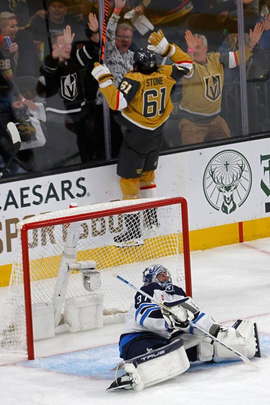 Golden Knights right wing Mark Stone (61) celebrates after scoring against Winnipeg Jets goalte ...