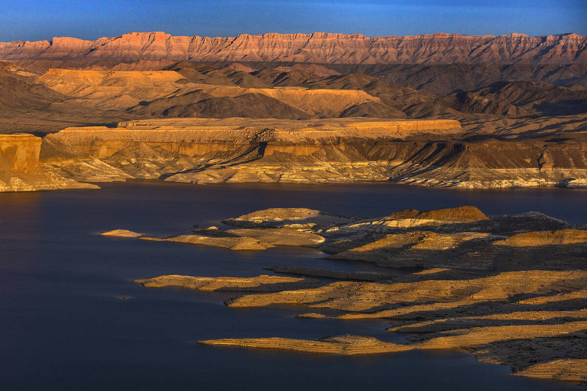 The sun sets on Temple Bar about the receding Lake Mead shoreline in March 2023 in Boulder City ...