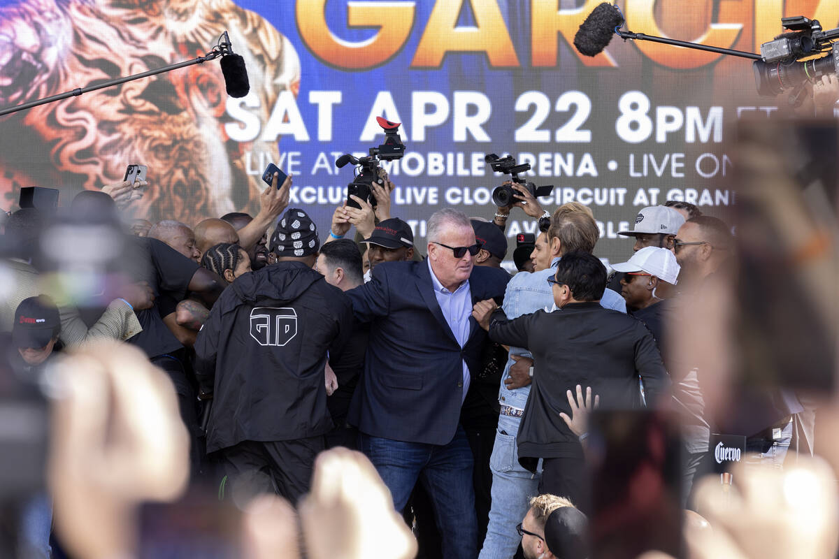 Gervonta Davis and Ryan Garcia are separated from fighting during their weigh-ins at Toshiba Pl ...