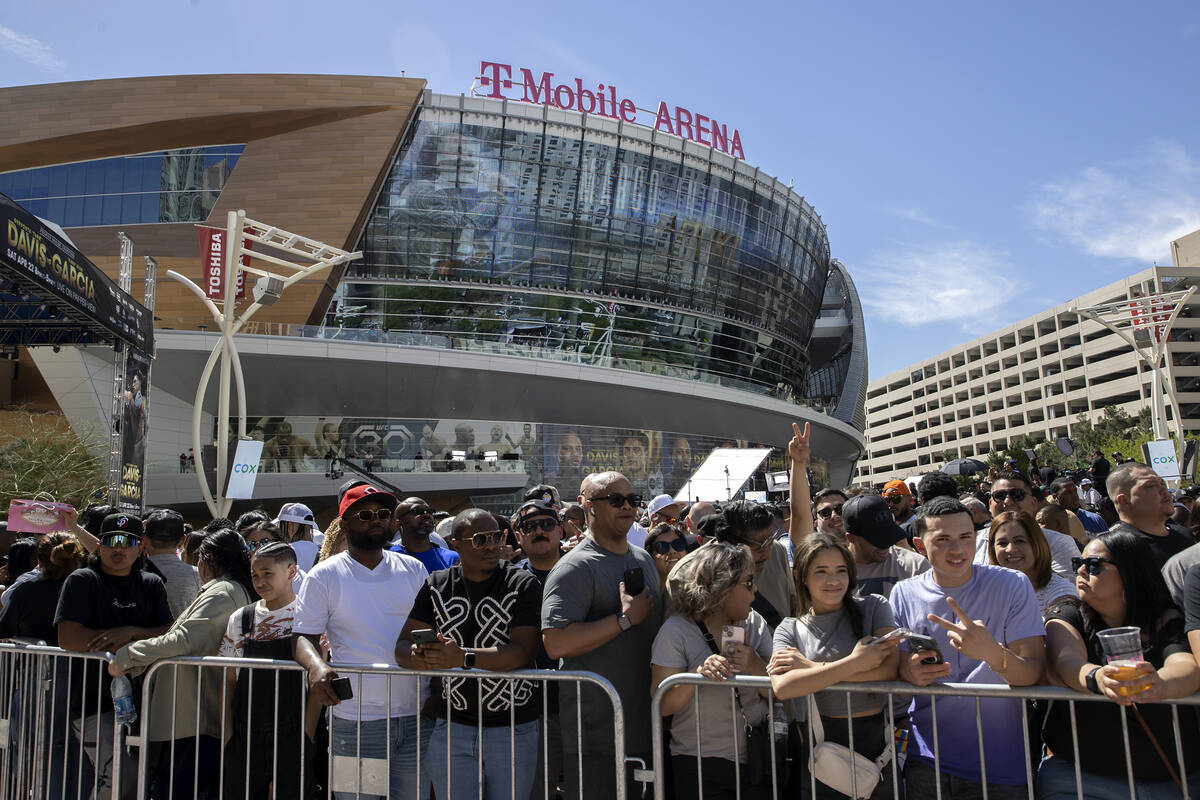 Fans gather to watch weigh-ins ahead of the Davis vs. Garcia fight at Toshiba Plaza on Friday, ...