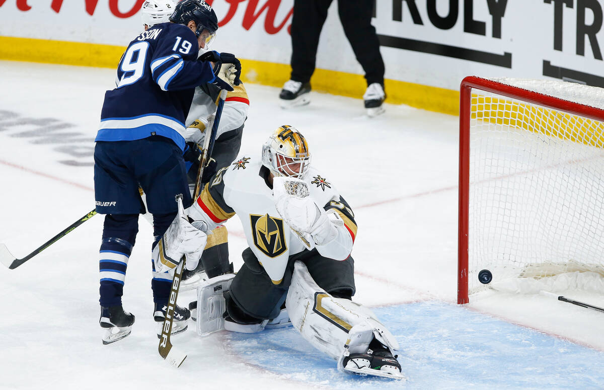 Vegas Golden Knights goaltender Laurent Brossoit (39) looks back as the Winnipeg Jets' shot goe ...