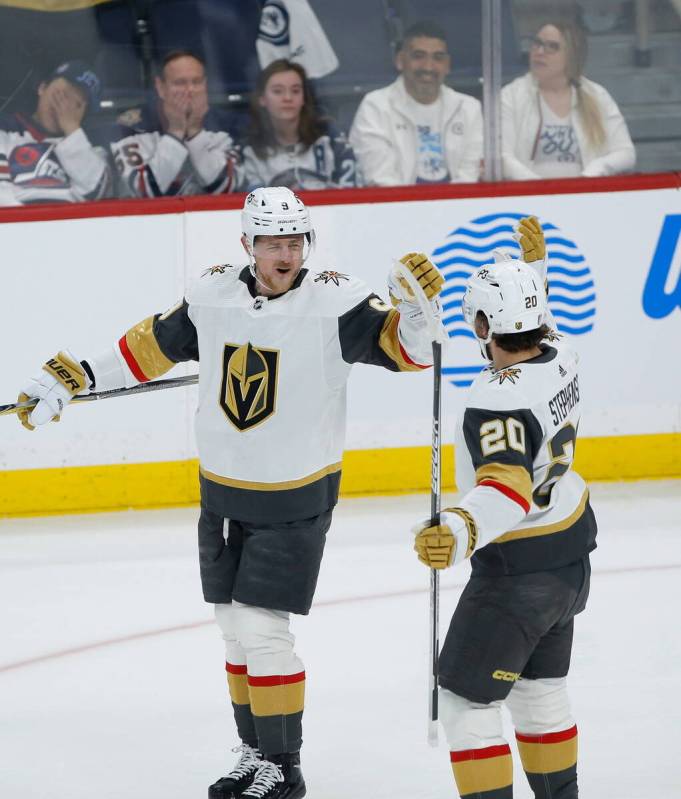 Vegas Golden Knights' Jack Eichel (9) and Chandler Stephenson (20) celebrate Eichel's goal agai ...