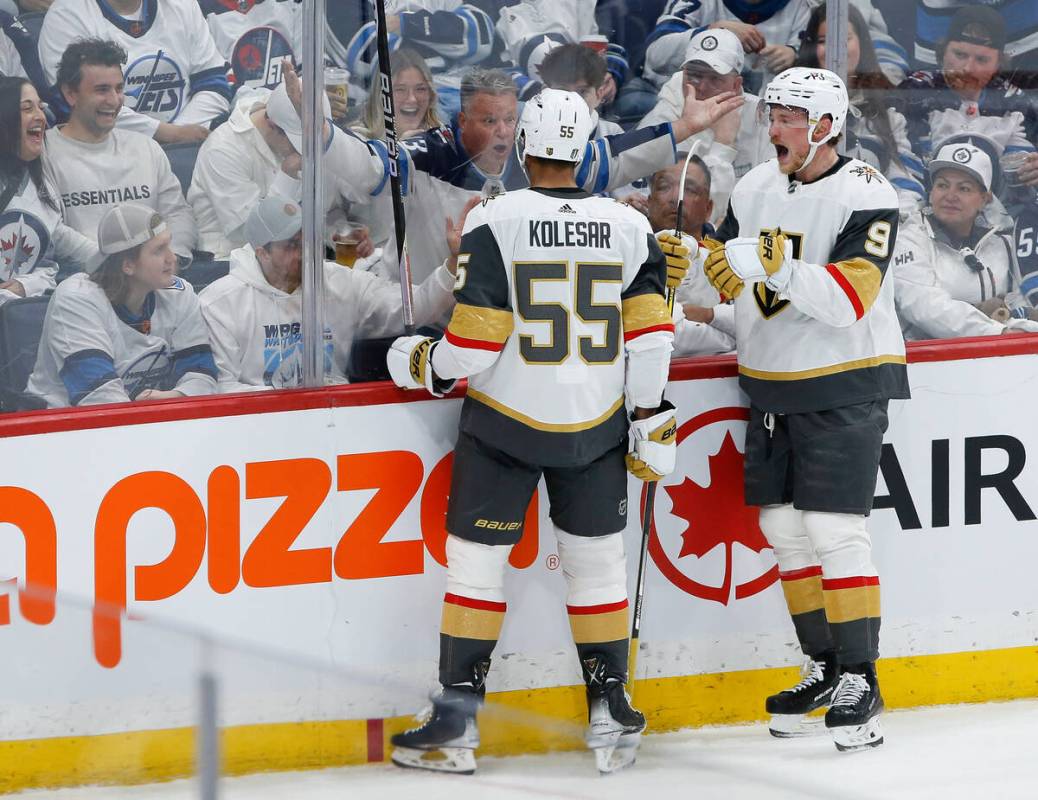 Vegas Golden Knights' Keegan Kolesar (55) and Jack Eichel (9) celebrate after Kolesar scored ag ...