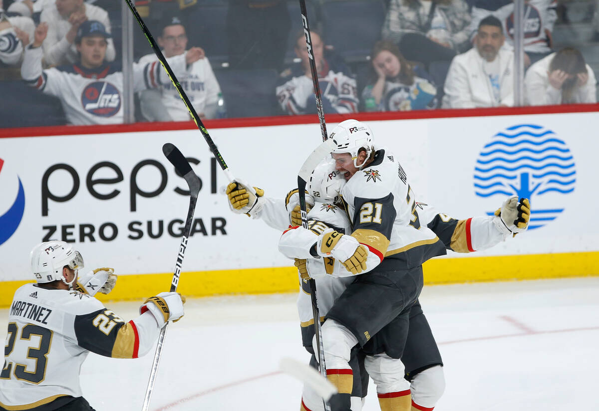 Vegas Golden Knights' Alec Martinez (23), Michael Amadio (22), Brett Howden (21) and Ivan Barba ...