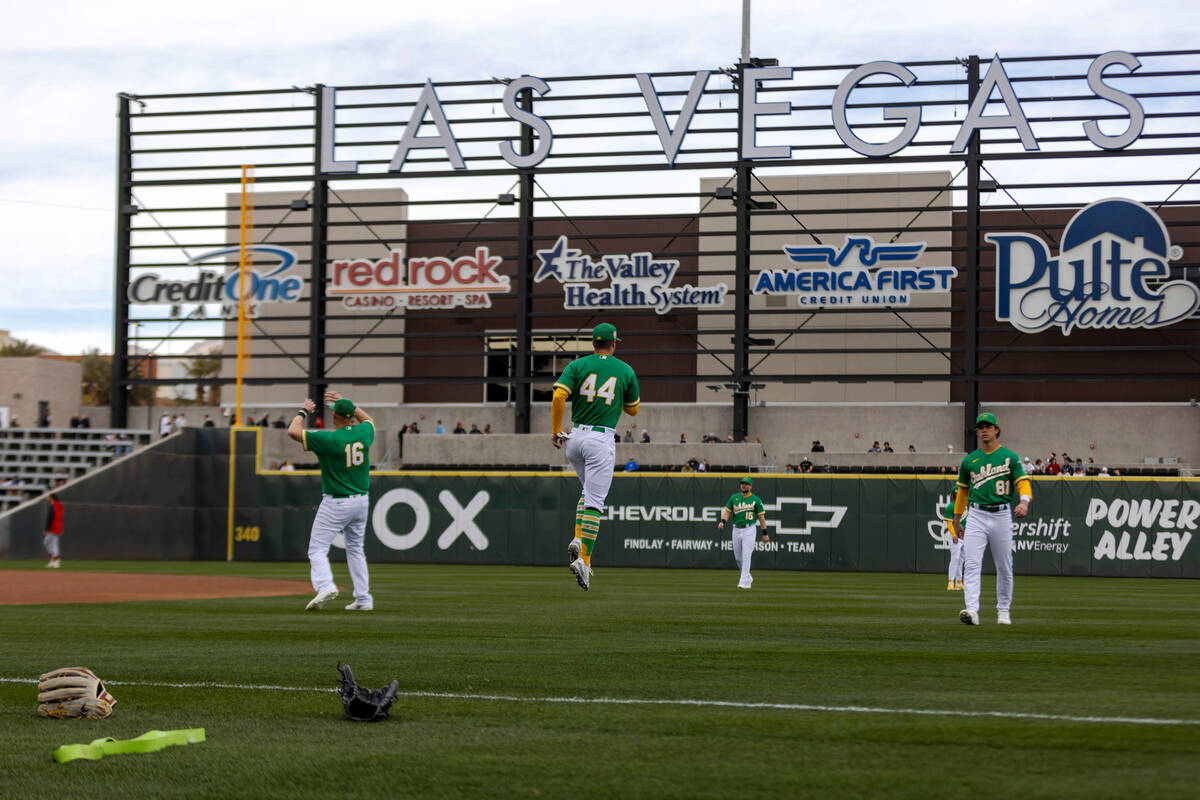 Oakland Athletics first baseman Kevin Cron (16), outfielder Ernie Clement (44), designated hitt ...