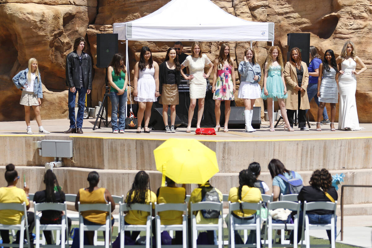 Youth Conservation Council members stand on stage after participating in a sustainable fashion ...