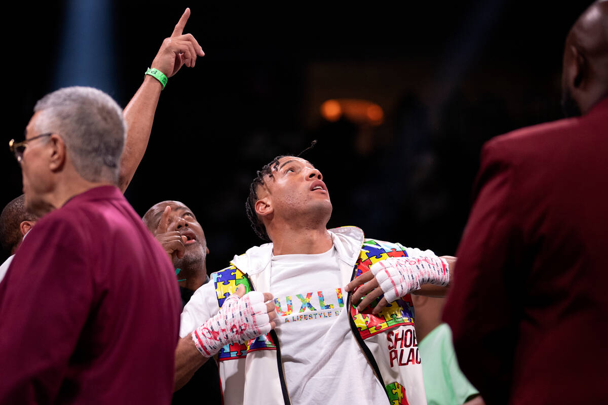 David Morrell Jr. watches a replay of his knockout super middleweight boxing bout against Yamag ...