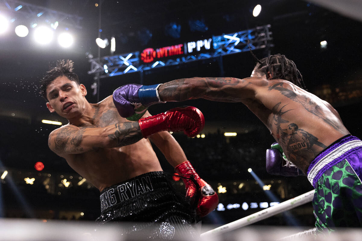 Gervonta Davis punches Ryan Garcia during a catchweight boxing bout at T-Mobile Arena on Saturd ...