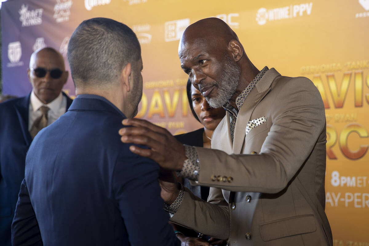 Former world champion boxer Bernard Hopkins, right, speaks to Showtime president Stephen Espino ...