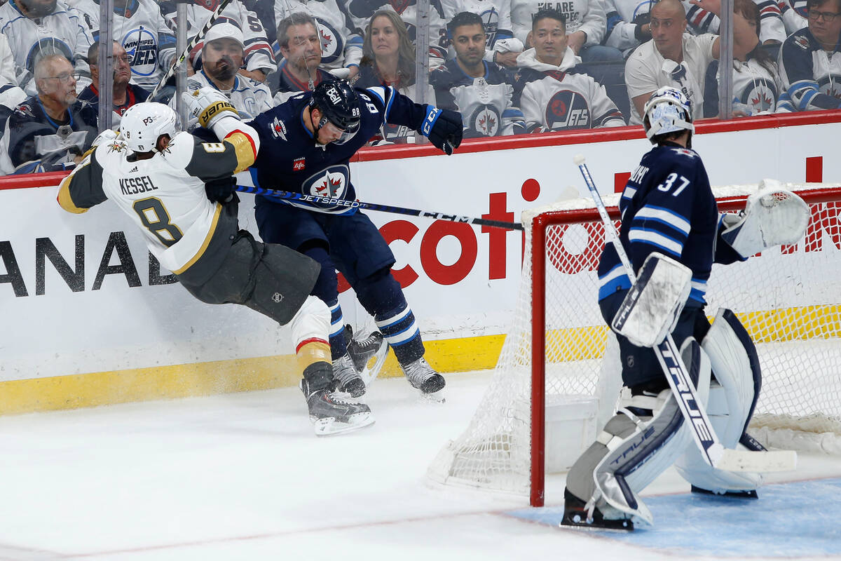 Winnipeg Jets' Nate Schmidt (88) and Vegas Golden Knights' Phil Kessel (8) collide during the f ...