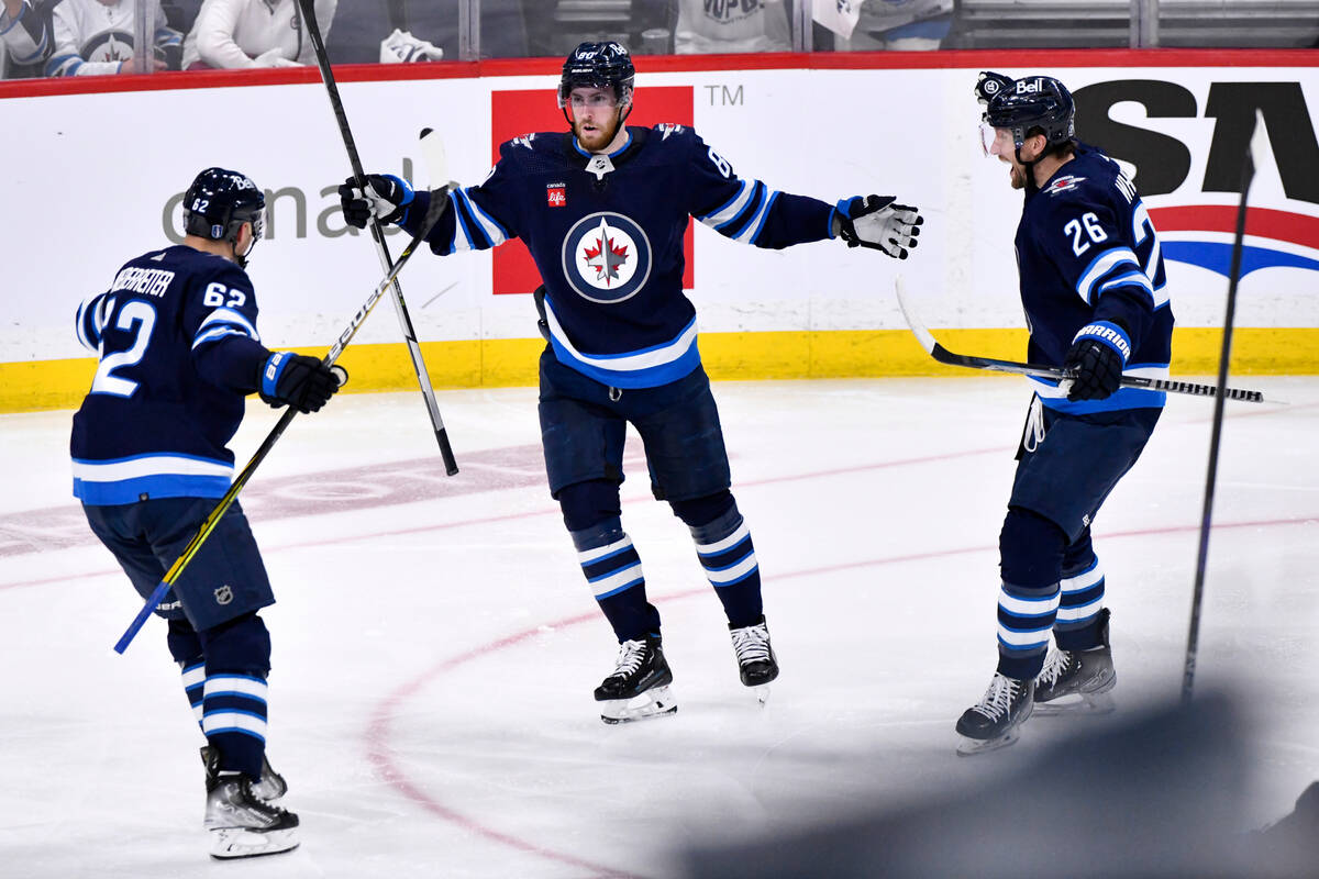 Winnipeg Jets' Pierre-Luc Dubois (80) celebrates his goal against the Vegas Golden Knights with ...